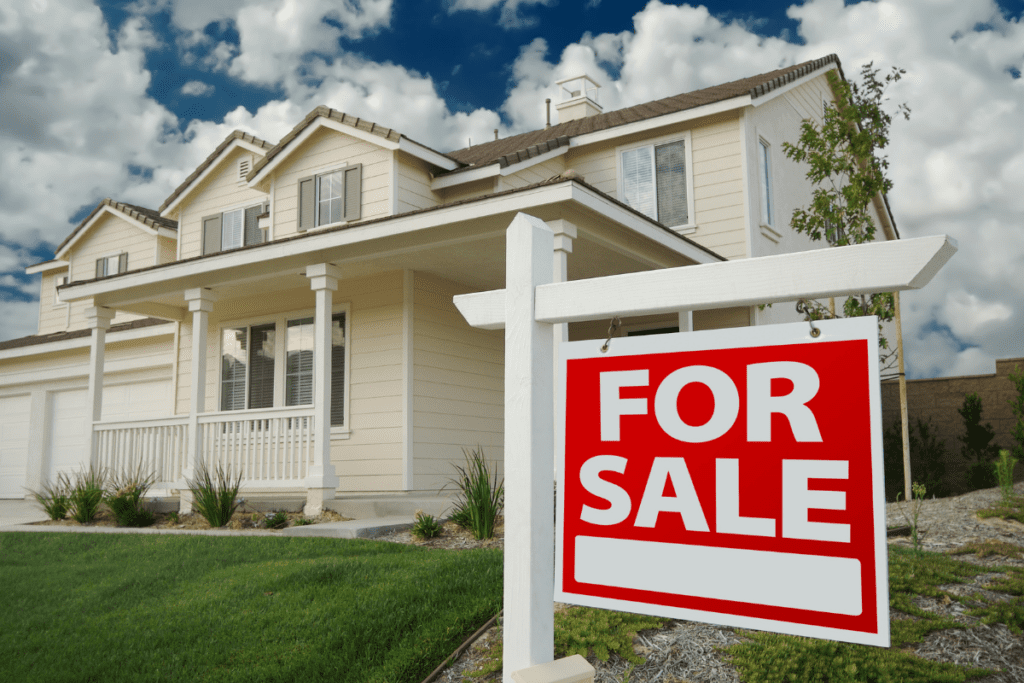 Suburban house with large For Sale sign